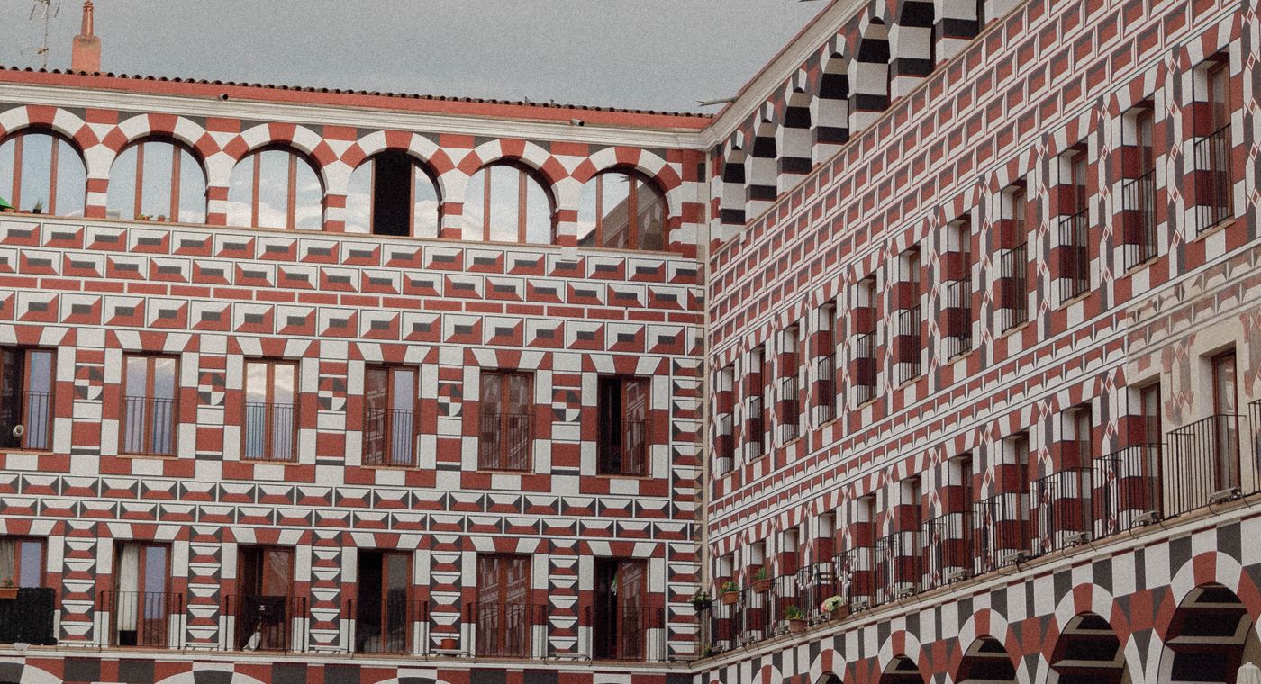 Explore the ornate architecture of an historic courtyard in Badajoz, Spain's old town.