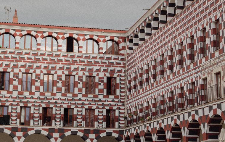 Explore the ornate architecture of an historic courtyard in Badajoz, Spain's old town.