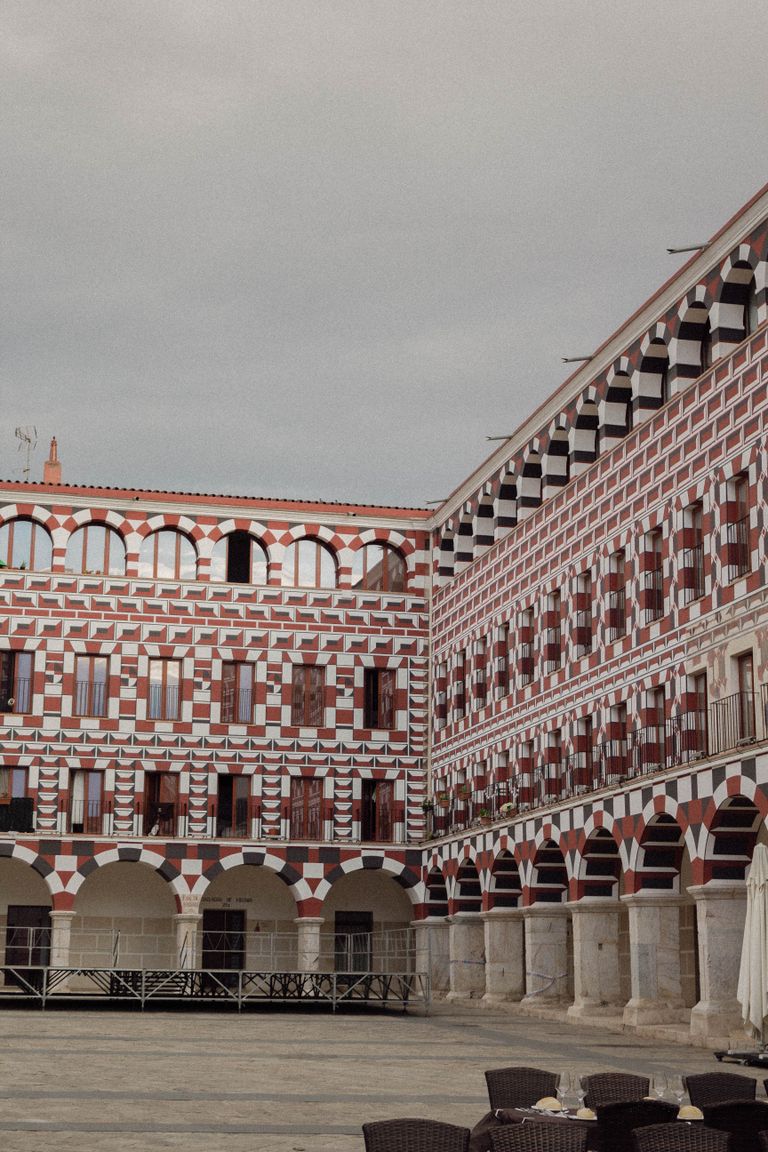 Explore the ornate architecture of an historic courtyard in Badajoz, Spain's old town.